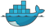 Docker logo. A cute blue smiling whale with blue containers on it.